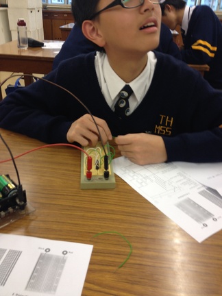 A student completes the circuit. 